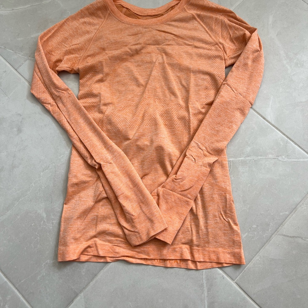 Lululemon orange long-sleeve shirt